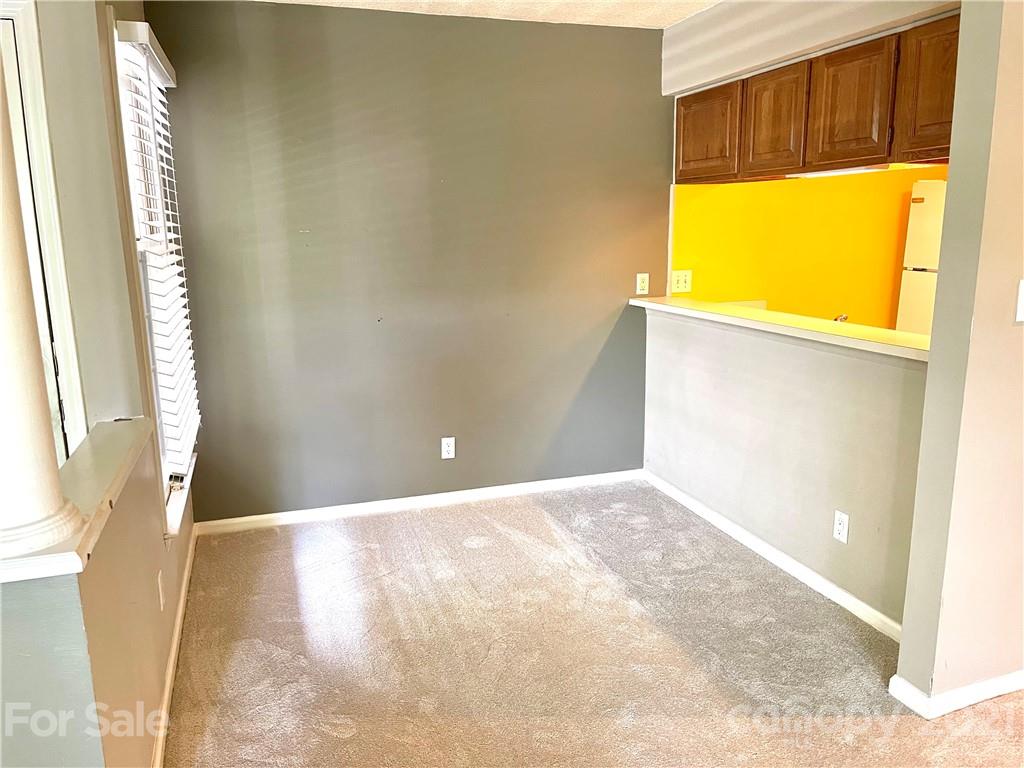 308 Queens Road, Unit 23 Charlotte, NC 28204 - Photo 9 of 22 a view of an empty room with a window
