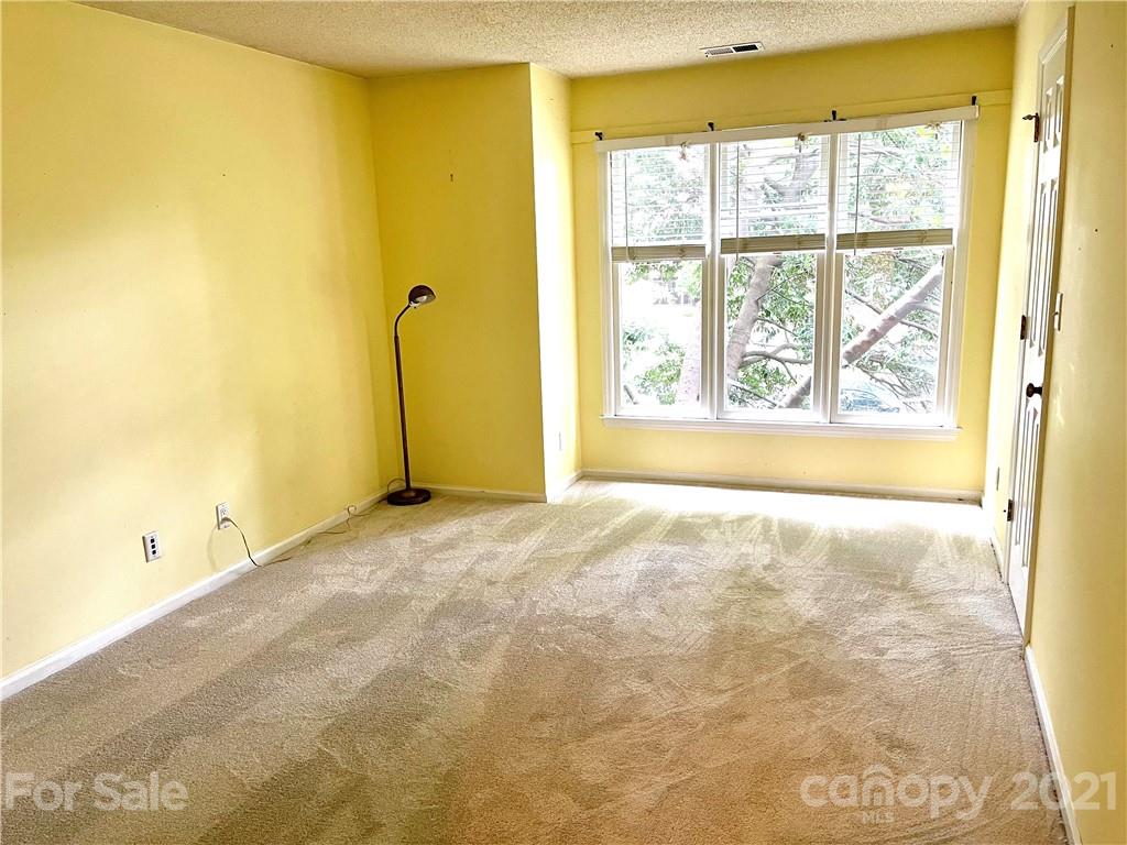 308 Queens Road, Unit 23 Charlotte, NC 28204 - Photo 10 of 22 a view of a room with an empty room