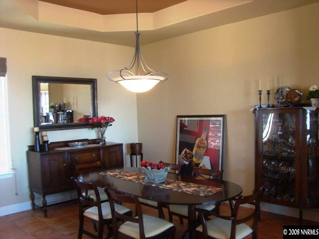 523 Echo Ridge Court Reno, NV 89511 - Photo 3 of 9 a view of a dining room with furniture and chandelier
