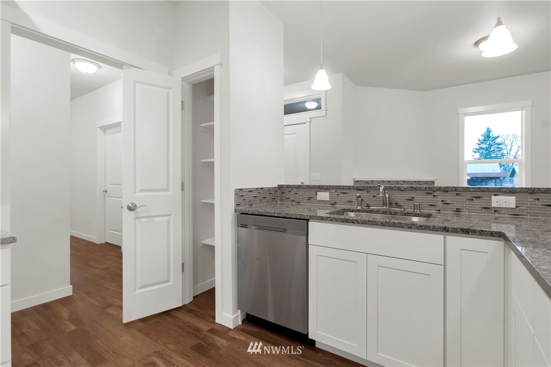 674 Southwest 20th Street Chehalis, WA 98532 - Photo 11 of 29 a bathroom with a granite countertop sink and a mirror