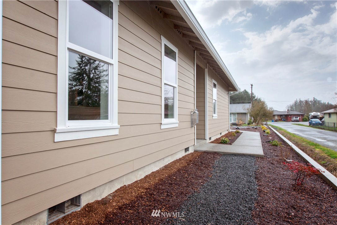 674 Southwest 20th Street Chehalis, WA 98532 - Photo 3 of 29 a view of a house with a backyard