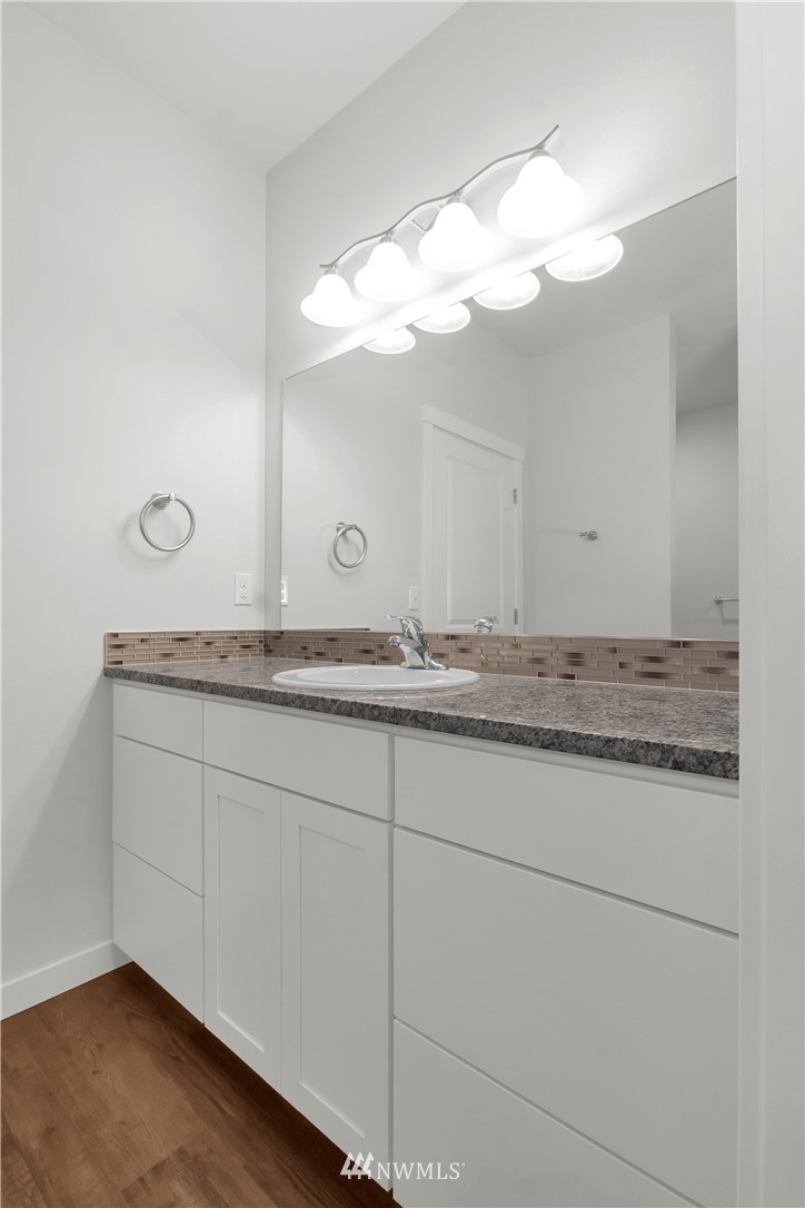 674 Southwest 20th Street Chehalis, WA 98532 - Photo 23 of 29 a bathroom with a sink and a mirror