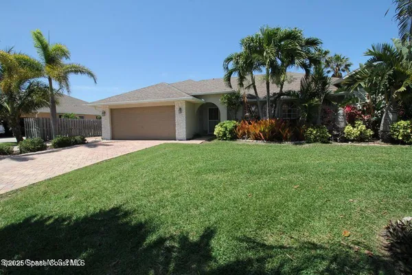 a front view of house with yard and green space