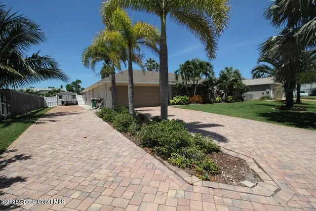 a view of a backyard with a garden