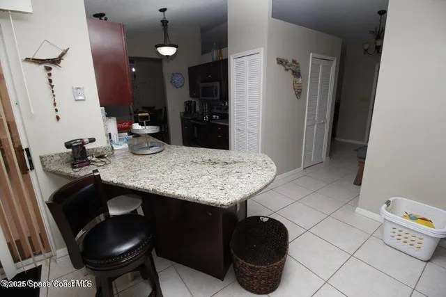 a view of a kitchen area with furniture and chandelier