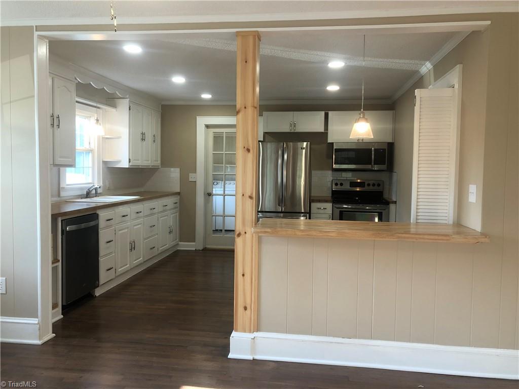 216 Cedarbrook Road Jonesville, NC 28642 - Photo 2 of 19 From den to kitchen, open format.