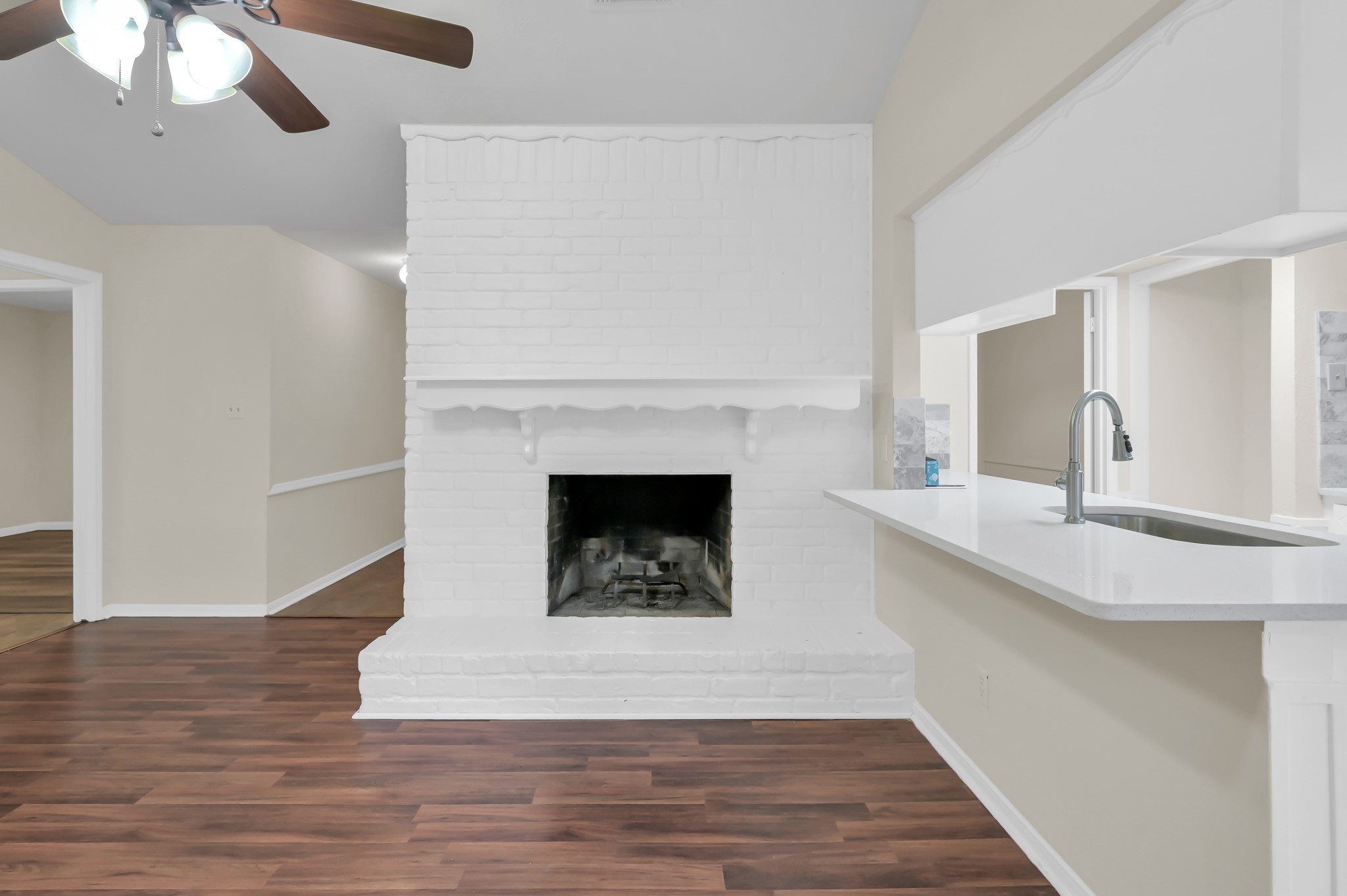 29610 Loddington Street Spring, TX 77386 - Photo 12 of 40 a living room with a fireplace and wooden floor