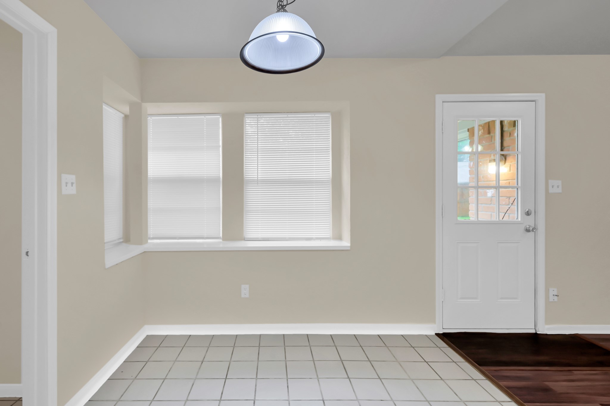 29610 Loddington Street Spring, TX 77386 - Photo 14 of 40 a view of an empty room with wooden floor and a window