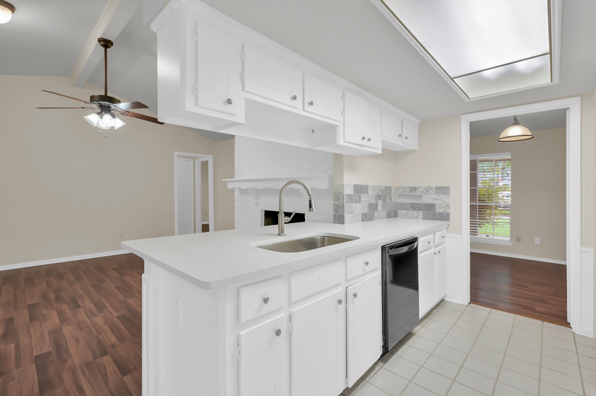 29610 Loddington Street Spring, TX 77386 - Photo 17 of 40 a kitchen with a sink dishwasher and a stove