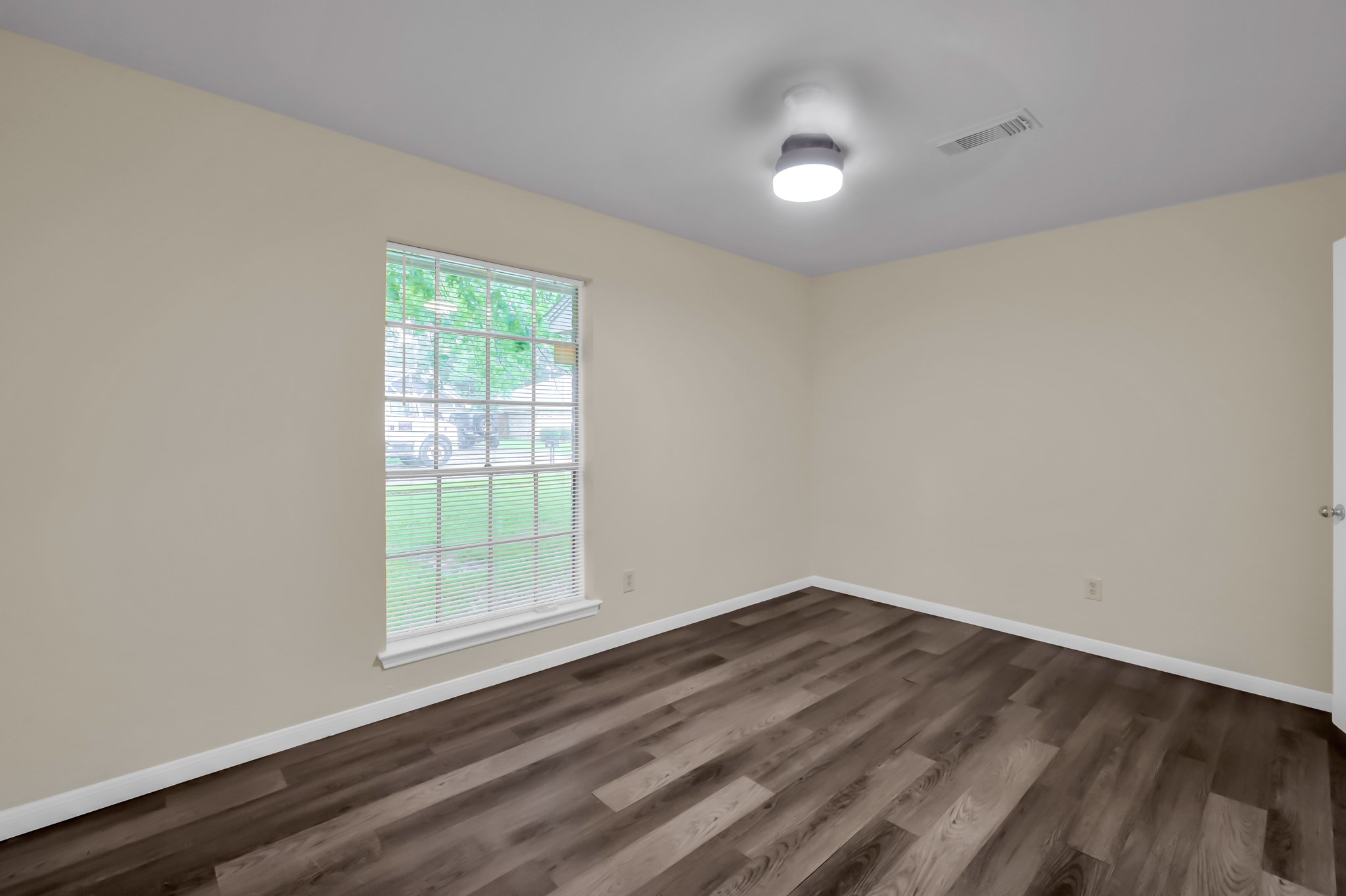 29610 Loddington Street Spring, TX 77386 - Photo 27 of 40 an empty room with wooden floor and windows