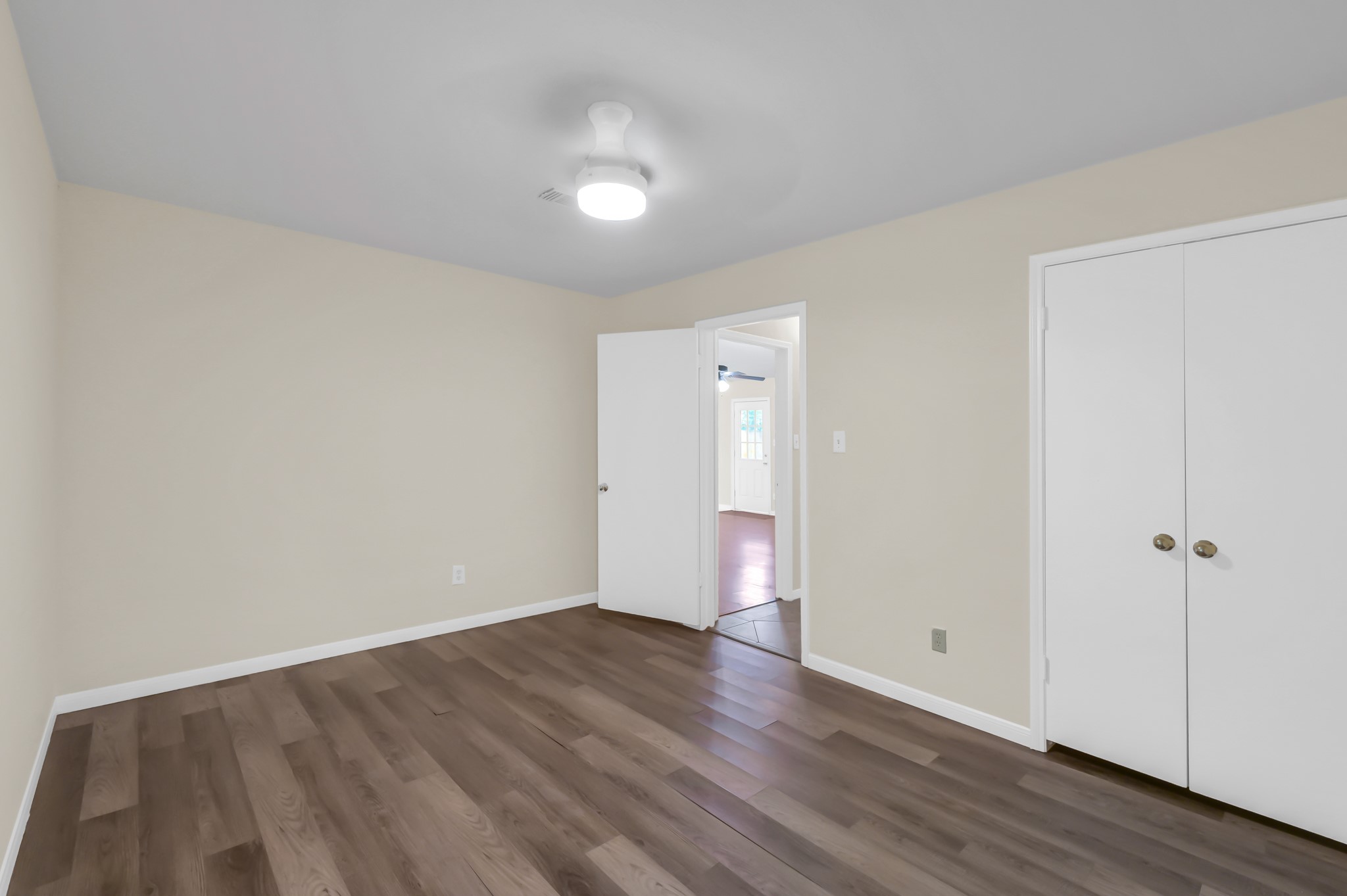 29610 Loddington Street Spring, TX 77386 - Photo 28 of 40 a view of an empty room with wooden floor
