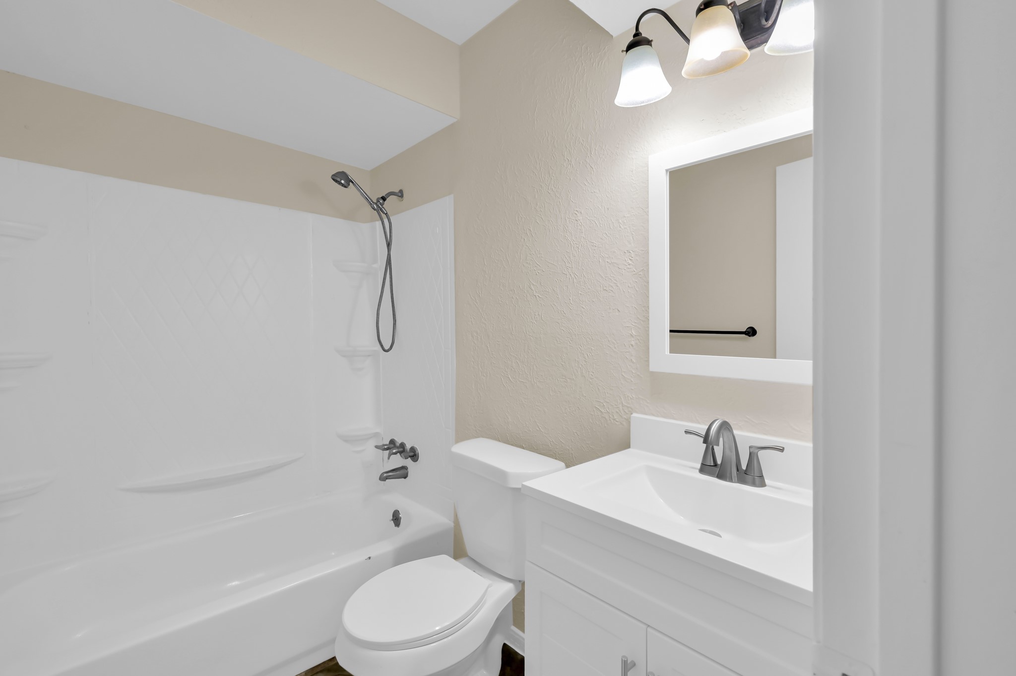 29610 Loddington Street Spring, TX 77386 - Photo 30 of 40 a bathroom with a sink vanity mirror and toilet