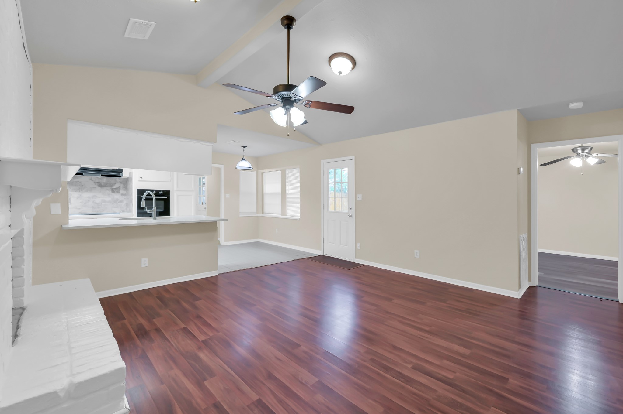 29610 Loddington Street Spring, TX 77386 - Photo 9 of 40 a view of an empty room with window and wooden floor