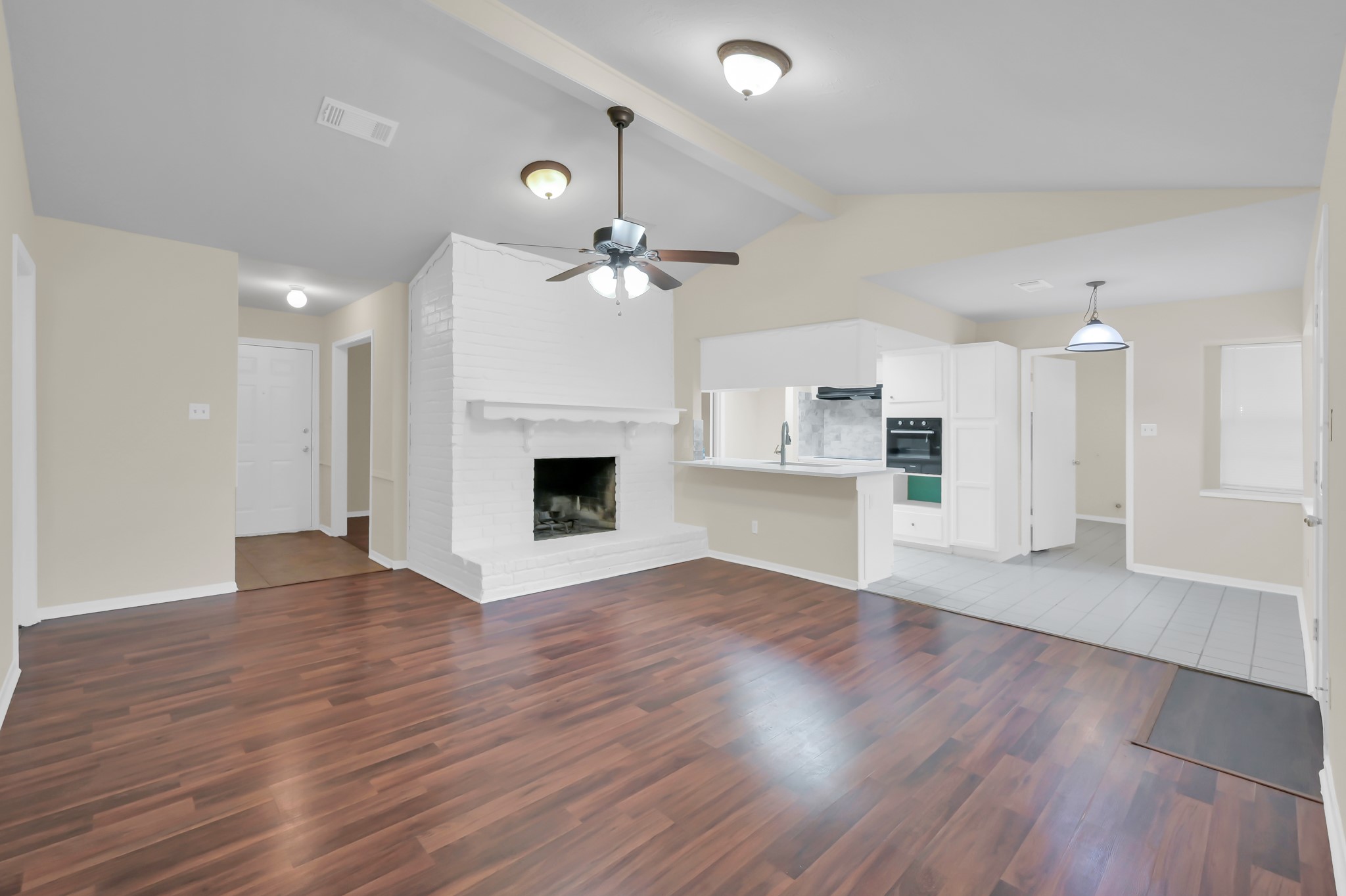 29610 Loddington Street Spring, TX 77386 - Photo 10 of 40 a view of empty room with wooden floor and fireplace