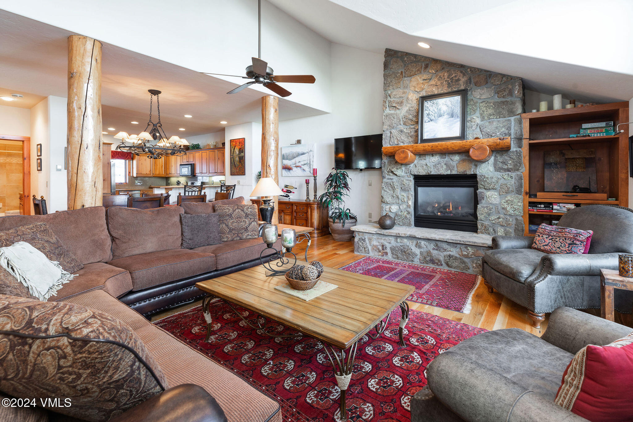 42 Knudson Ranch Road Edwards, CO 81632 - Photo 1 of 22 a living room with furniture a flat screen tv and a fireplace