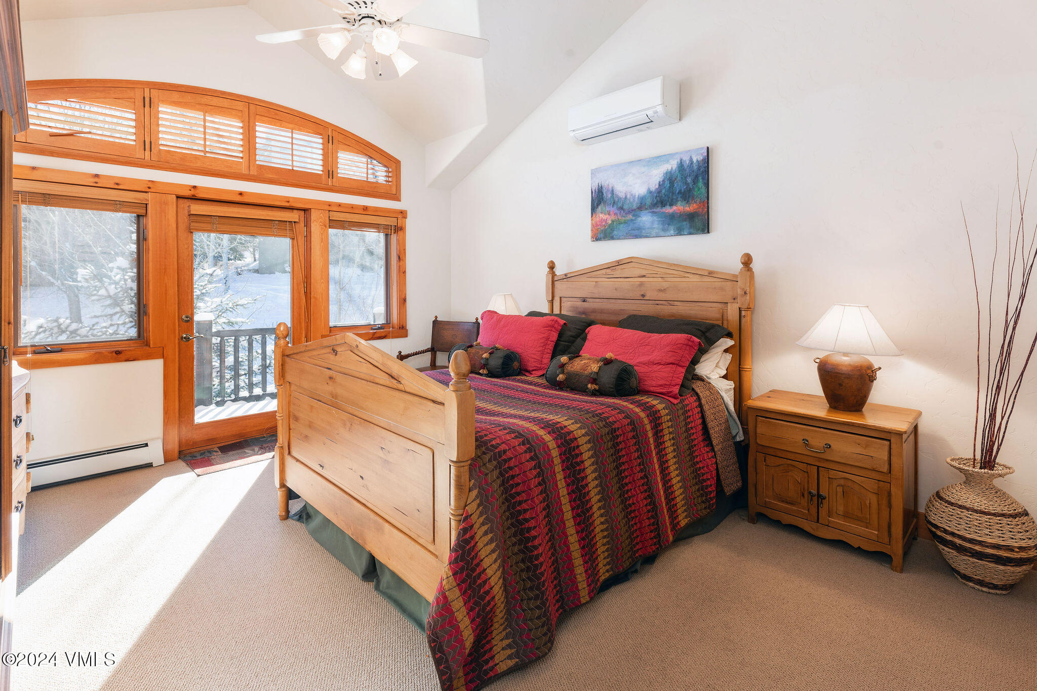 42 Knudson Ranch Road Edwards, CO 81632 - Photo 13 of 22 a spacious bedroom with a bed and a large window
