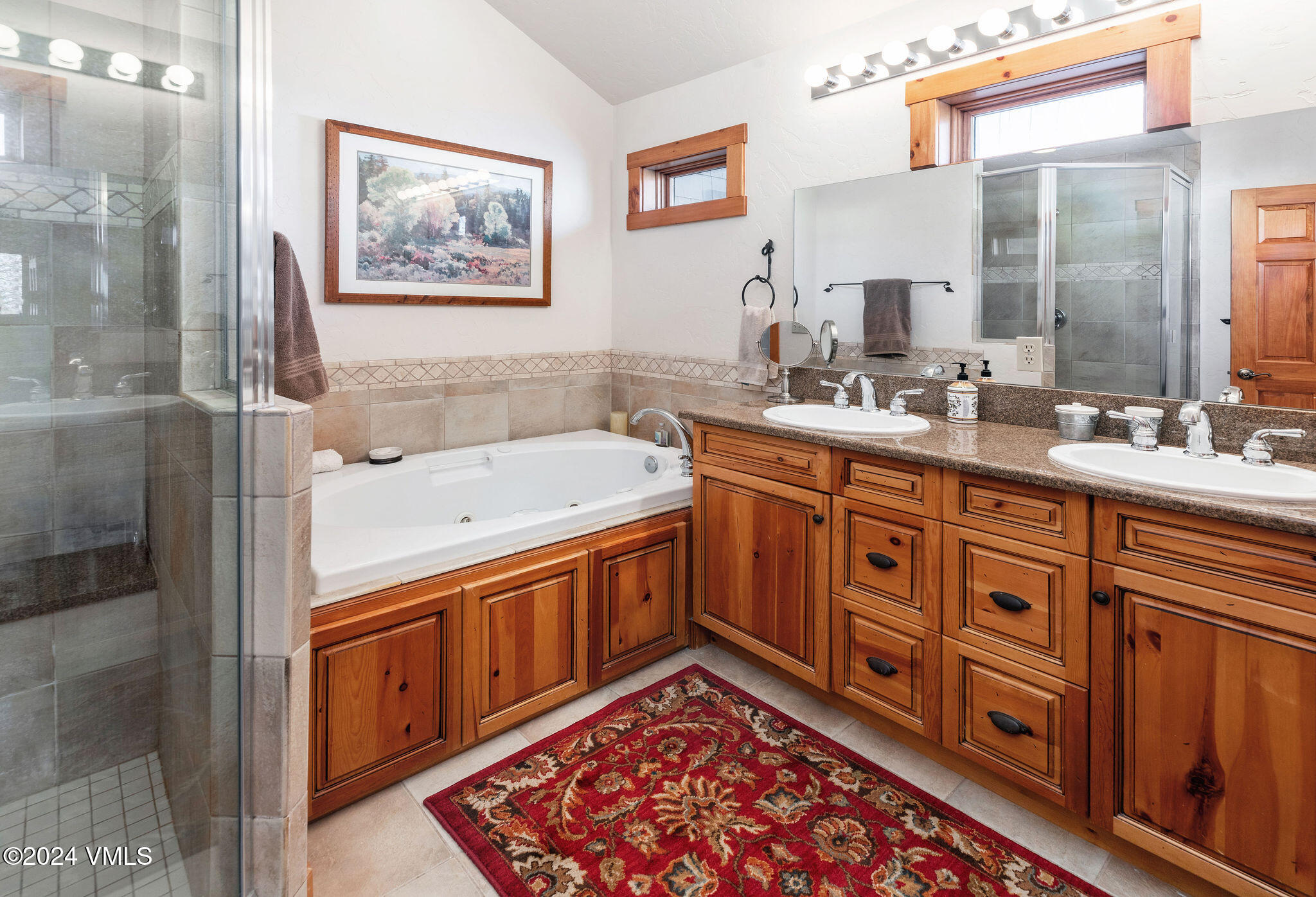 42 Knudson Ranch Road Edwards, CO 81632 - Photo 14 of 22 a bathroom with a sink double vanity and a tub