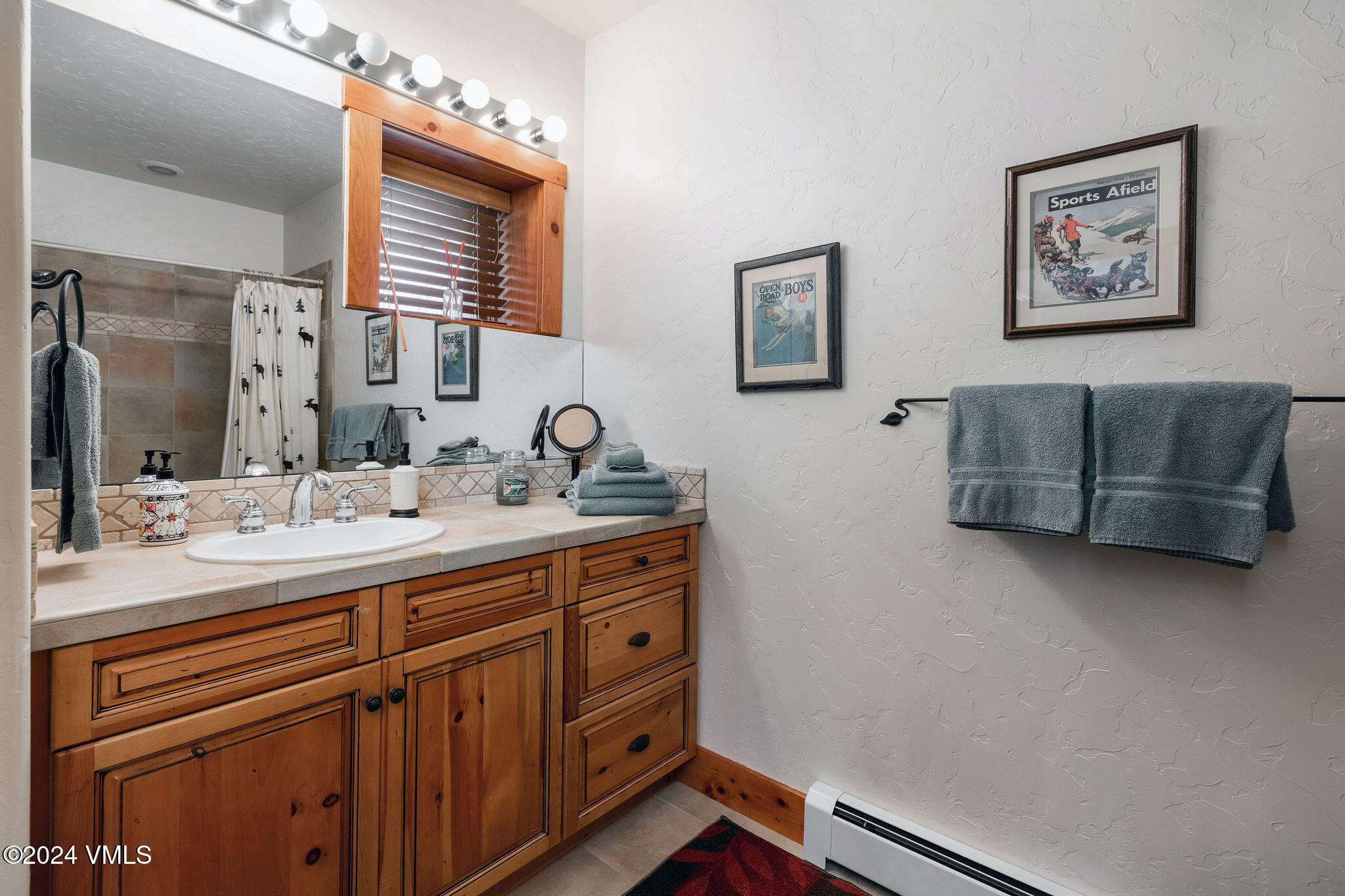 42 Knudson Ranch Road Edwards, CO 81632 - Photo 18 of 22 a bathroom with a double vanity sink and a mirror
