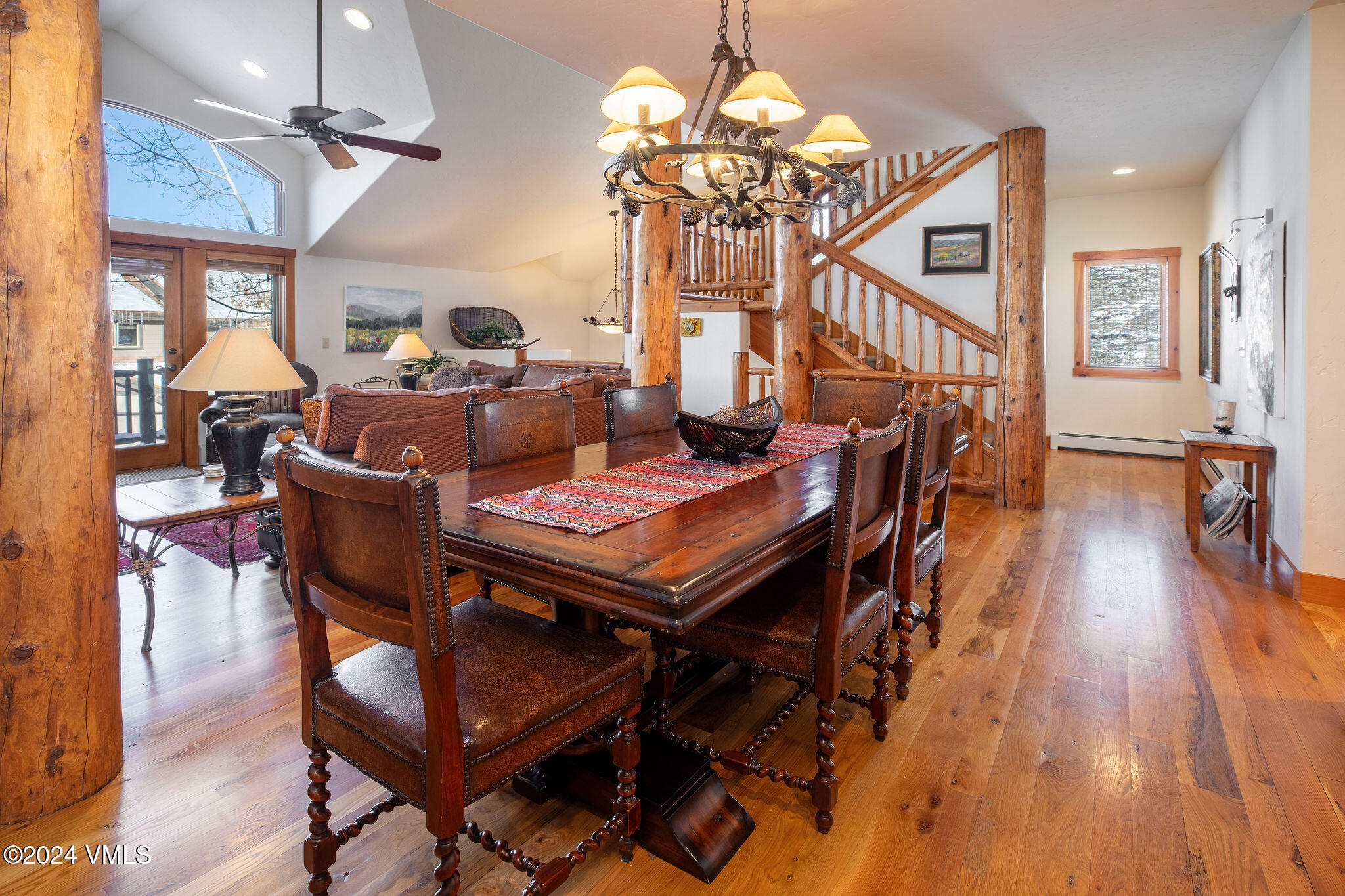 42 Knudson Ranch Road Edwards, CO 81632 - Photo 3 of 22 a view of a dining room with furniture a chandelier and wooden floor