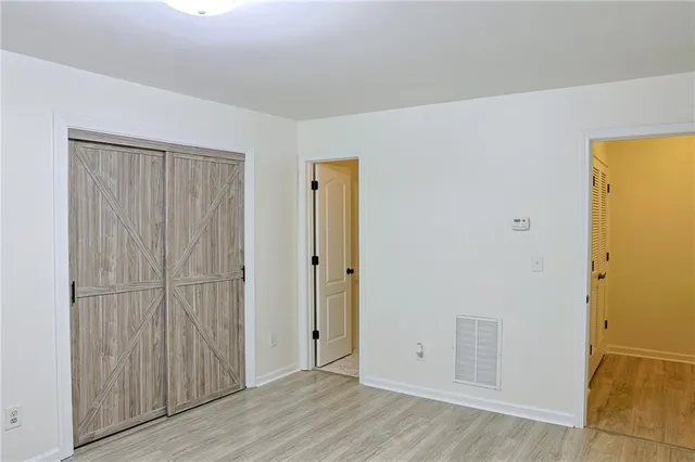 an empty room with wooden floor