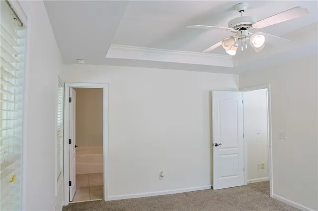 a view of a chandelier fan and entryway