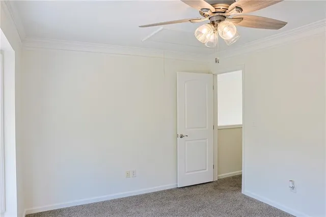 a view of a chandelier fan in a room