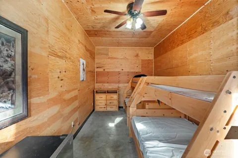 a bedroom with bed and a chandelier