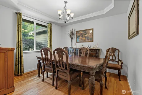 a view of a hallway with couch and a potted plant