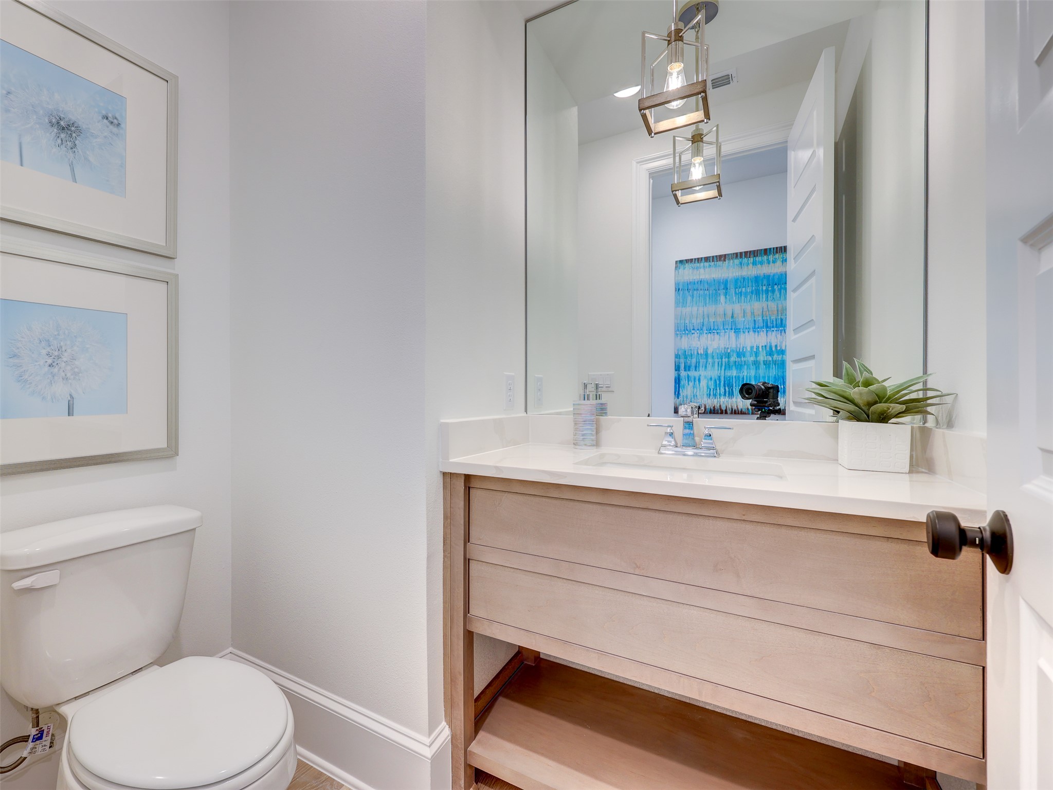 6220 Bower Well Road Austin, TX 78738 - Photo 17 of 28 Modern vanity with a sleek countertop and stylish light fixture illuminates this pristine lavatory.
