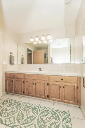 a view of a livingroom with furniture window and a kitchen