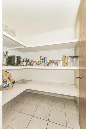 a bedroom with a bed and cabinets