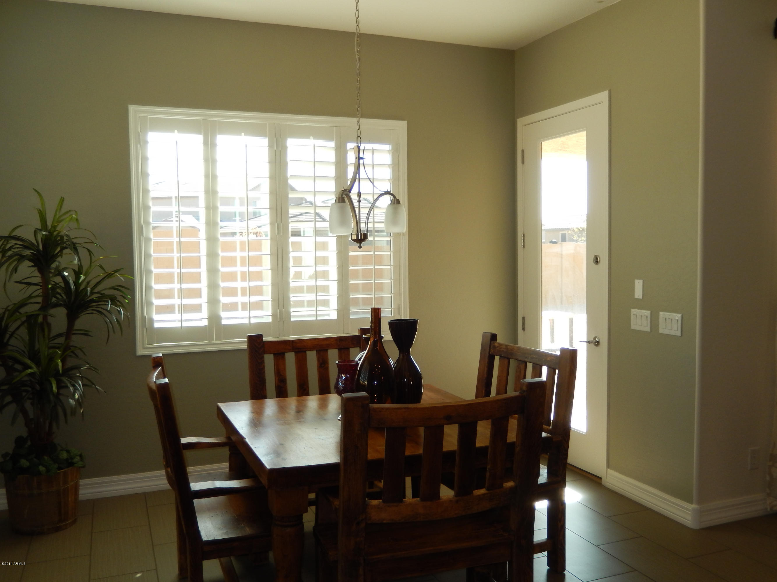 16079 West Coronado Road Goodyear, AZ 85395 - Photo 11 of 32 KITCHEN DINING AREA-DOOR TO PATIO