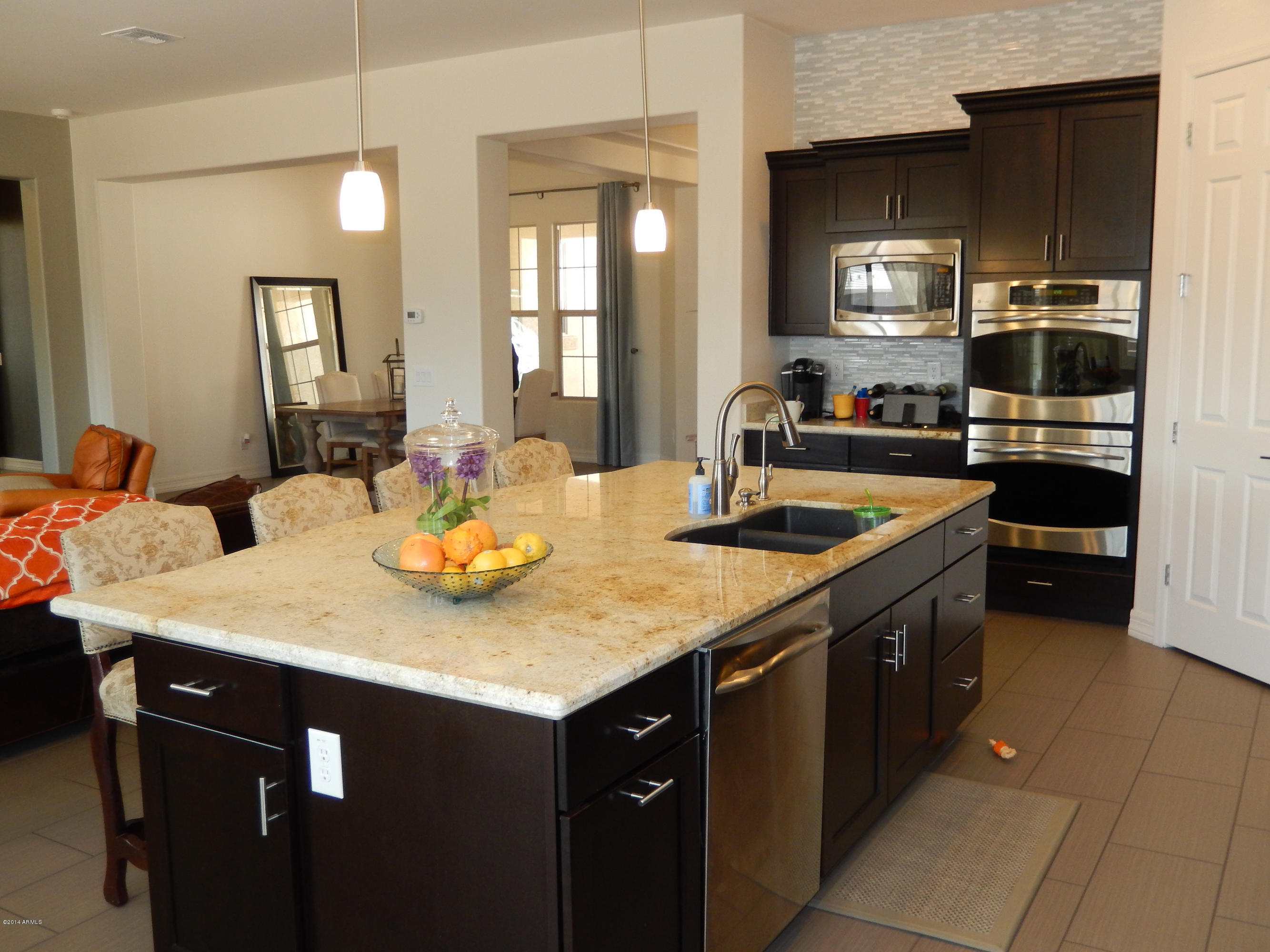 16079 West Coronado Road Goodyear, AZ 85395 - Photo 10 of 32 KITCHEN OPENS TO GREAT ROOM