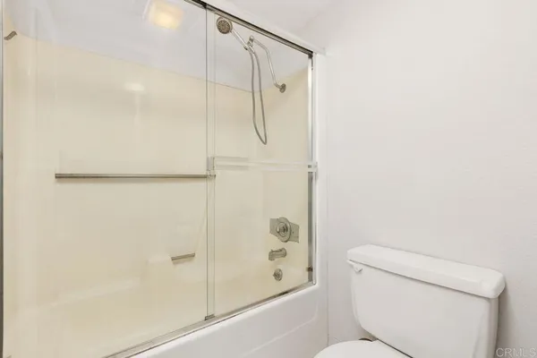 a open kitchen with stainless steel appliances granite countertop a stove and a refrigerator