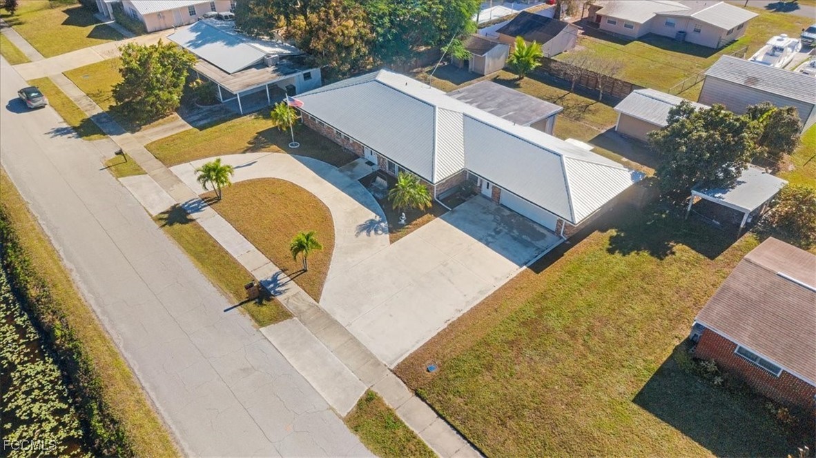 610 East Avenida Del Rio Clewiston, FL 33440 - Photo 2 of 49 an aerial view of a house with swimming pool