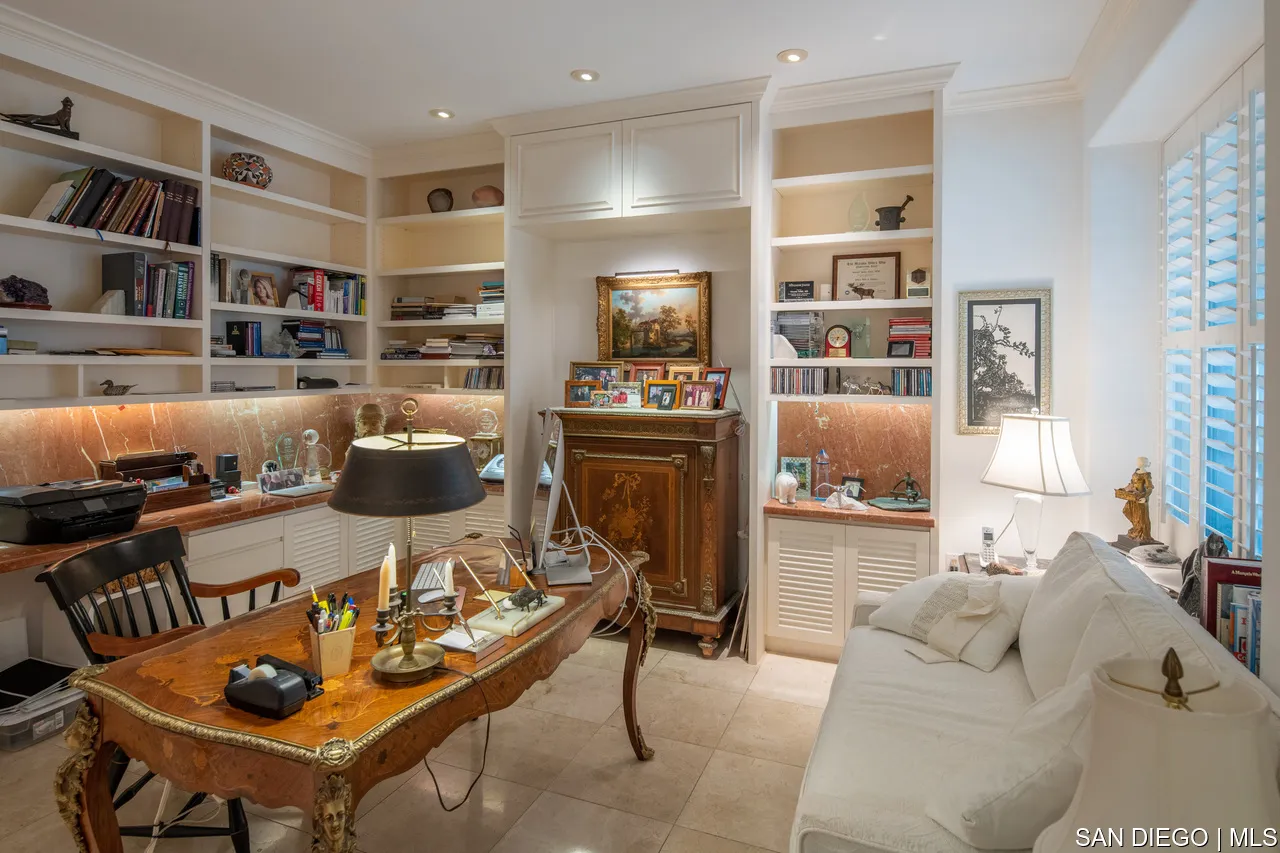 464 Prospect Street, Unit PH5 La Jolla, CA 92037 - Photo 11 of 28 a living room with furniture and a book shelf