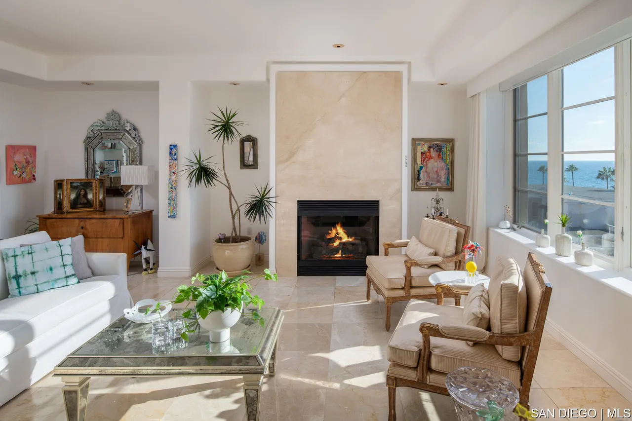 464 Prospect Street, Unit PH5 La Jolla, CA 92037 - Photo 5 of 28 a living room with furniture fireplace and potted plants