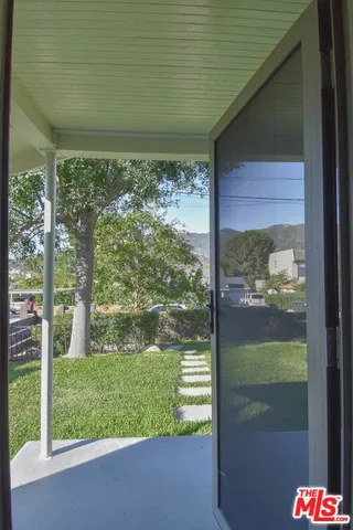a view of a backyard with a garden
