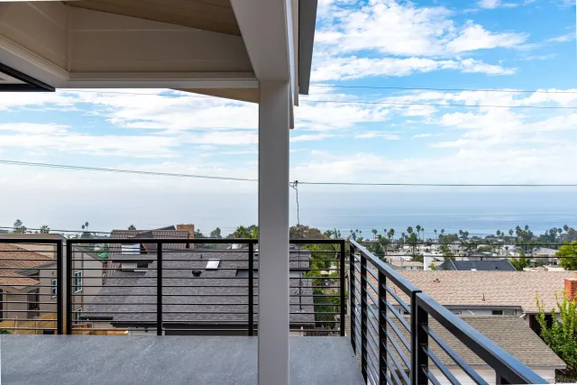 a view of a balcony with city view
