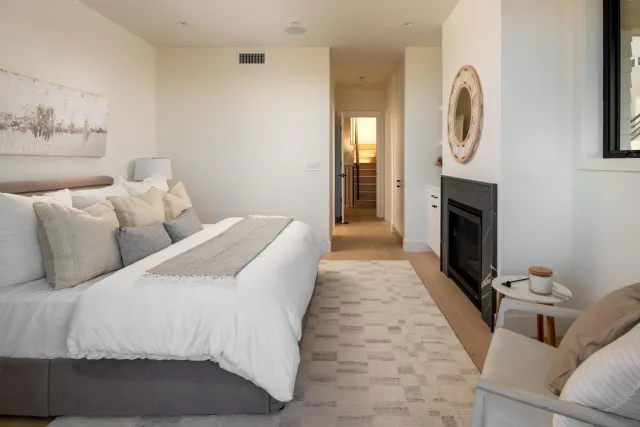 a bed room with two beds and a fireplace