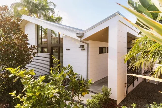 a front view of a house with garden