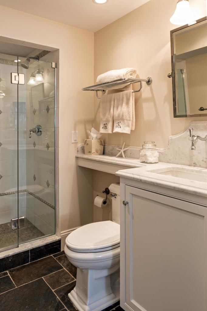 5 Uncatena Road Mashpee, MA 02649 - Photo 24 of 29 a bathroom with a granite countertop sink toilet and shower