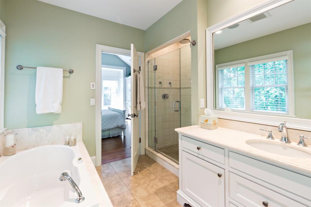 5 Uncatena Road Mashpee, MA 02649 - Photo 26 of 29 a bathroom with a tub sink and mirror