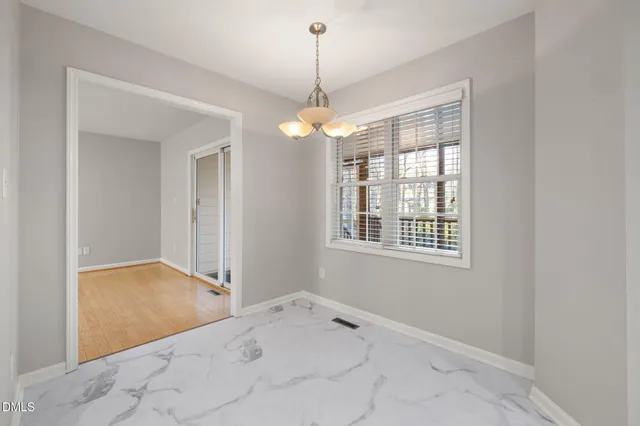 a kitchen with stainless steel appliances granite countertop cabinets and window