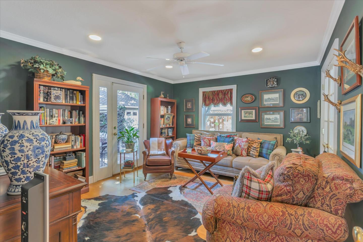 2084 Ellen Avenue San Jose, CA 95125 - Photo 20 of 43 a living room with furniture a bookshelf and a large window
