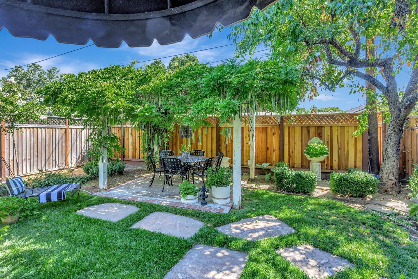 2084 Ellen Avenue San Jose, CA 95125 - Photo 34 of 43 a view of a chair and table in backyard of the house