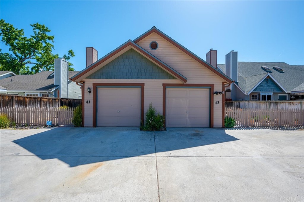 41 Brewer Street Templeton, CA 93465 - Photo 2 of 57 a front view of a house with a yard and garage