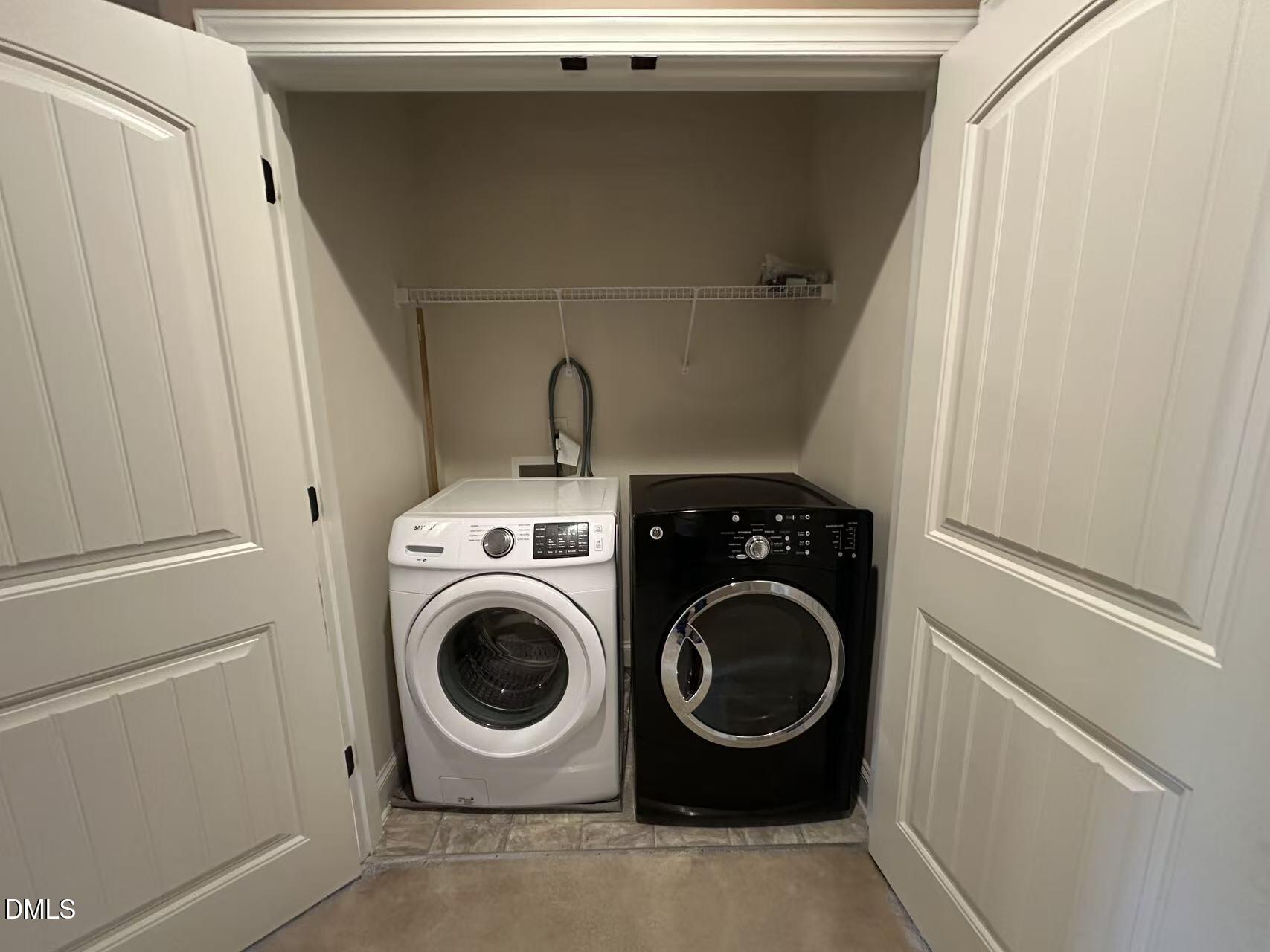 1056 Indigo Ridge Place Cary, NC 27519 - Photo 25 of 33 a utility room with dryer and washer