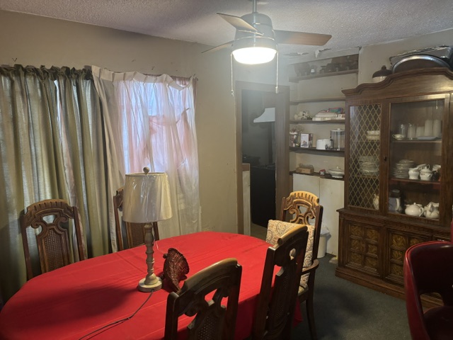 1702 Perez Street Austin, TX 78721 - Photo 12 of 17 a living room with furniture and a chandelier
