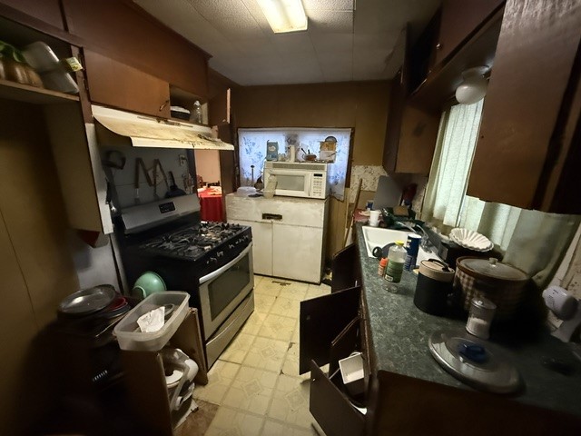 1702 Perez Street Austin, TX 78721 - Photo 10 of 17 a kitchen with a stove and a refrigerator